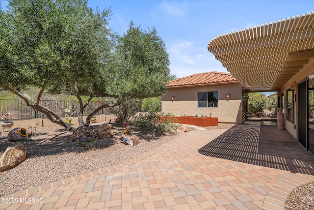 view of patio featuring fence