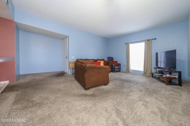 carpeted living area featuring visible vents
