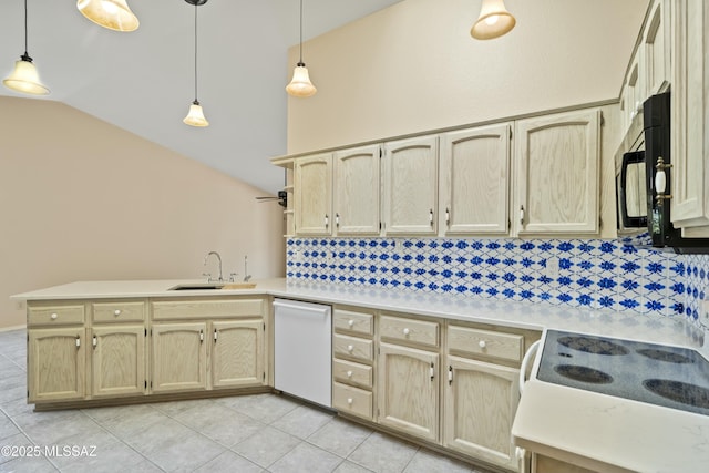 kitchen with black microwave, a peninsula, light tile patterned flooring, dishwasher, and a sink