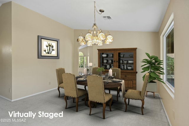dining space featuring a notable chandelier, carpet, visible vents, and baseboards