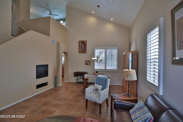 5200 E Calle Vista De Colores, Tucson, AZ 85711 - living area featuring plenty of natural light, arched walkways, high vaulted ceiling, and baseboards