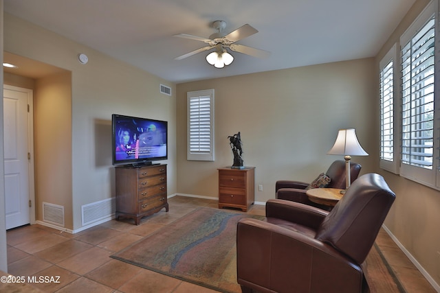 5200 E Calle Vista De Colores, Tucson, AZ 85711 - living room with baseboards, healthy amount of natural light, and a ceiling fan