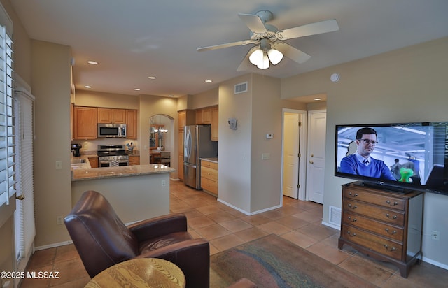 5200 E Calle Vista De Colores, Tucson, AZ 85711 - living area featuring ceiling fan, light tile patterned floors, baseboards, and recessed lighting