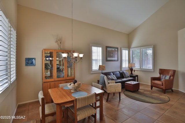 5200 E Calle Vista De Colores, Tucson, AZ 85711 - tiled dining space with high vaulted ceiling, a chandelier, and baseboards