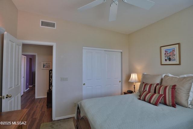 5200 E Calle Vista De Colores, Tucson, AZ 85711 - bedroom with a closet, wood finished floors, baseboards, and a ceiling fan