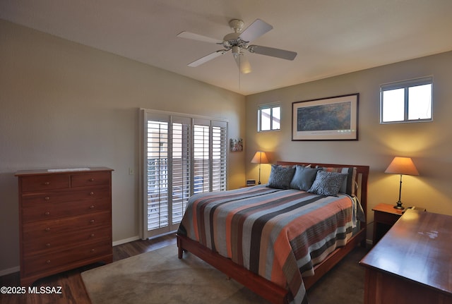 5200 E Calle Vista De Colores, Tucson, AZ 85711 - bedroom with access to outside, dark wood finished floors, baseboards, and multiple windows