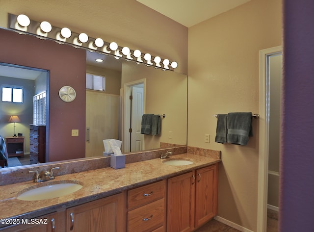 5200 E Calle Vista De Colores, Tucson, AZ 85711 - ensuite bathroom with double vanity and baseboards
