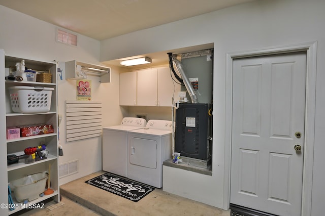 5200 E Calle Vista De Colores, Tucson, AZ 85711 - washroom featuring washing machine and dryer, cabinet space, and heating unit