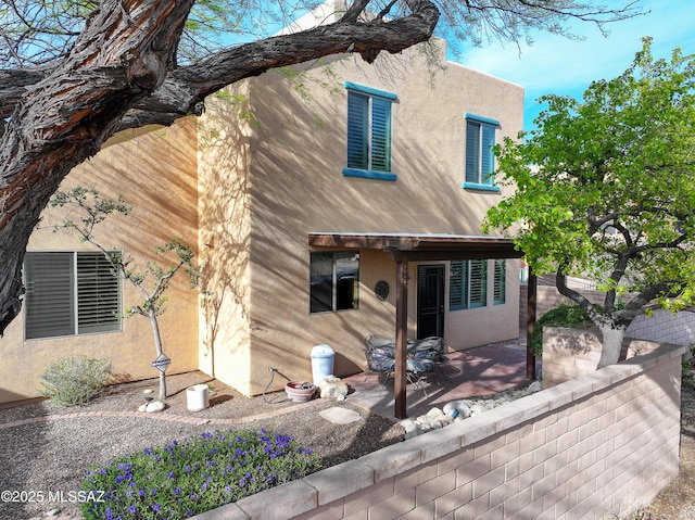 5200 E Calle Vista De Colores, Tucson, AZ 85711 - rear view of property with stucco siding and a patio area