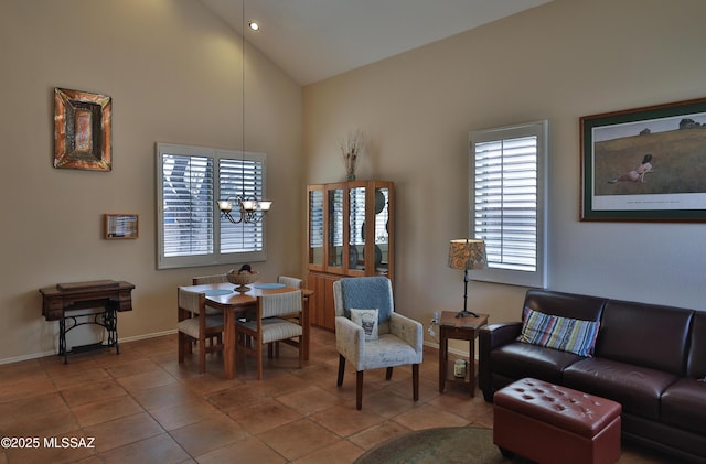 5200 E Calle Vista De Colores, Tucson, AZ 85711 - tiled living area with high vaulted ceiling, baseboards, a chandelier, and recessed lighting
