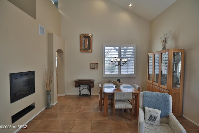 5200 E Calle Vista De Colores, Tucson, AZ 85711 - dining area with high vaulted ceiling, baseboards, a chandelier, and arched walkways