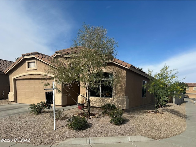 8332 S Otis Dr, Tucson, AZ 85747 - view of front of property with stucco siding, a tiled roof, and a garage