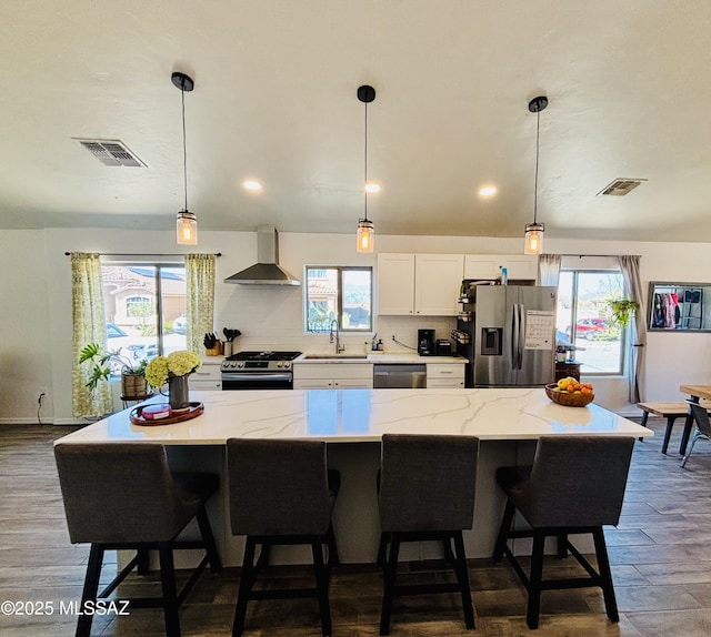 8332 S Otis Dr, Tucson, AZ 85747 - dining space with vaulted ceiling, an inviting chandelier, visible vents, and wood finished floors