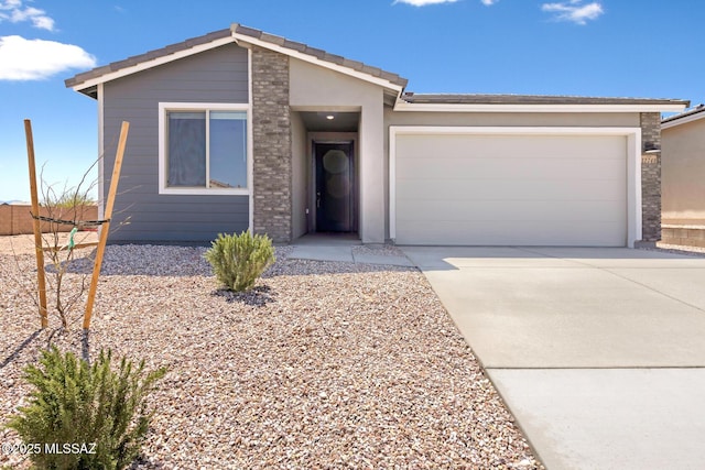 ranch-style home featuring an attached garage and driveway