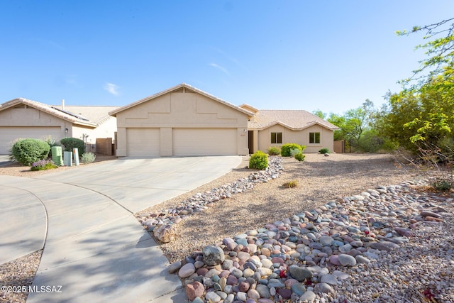 10532 E Malta St, Tucson, AZ 85747 - ranch-style house featuring an attached garage, driveway, and stucco siding