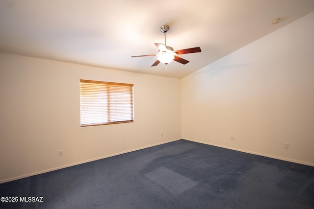 10532 E Malta St, Tucson, AZ 85747 - spare room with a ceiling fan, baseboards, dark colored carpet, a smoke detector, and vaulted ceiling