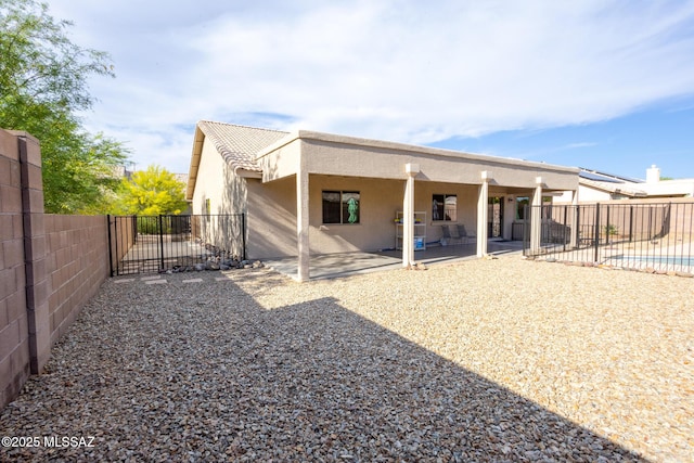10532 E Malta St, Tucson, AZ 85747 - back of house with a patio, a fenced backyard, and stucco siding