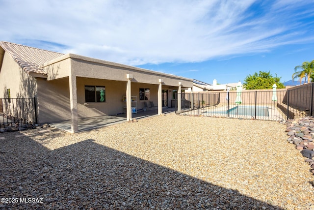 10532 E Malta St, Tucson, AZ 85747 - back of property with a fenced backyard, a patio area, and stucco siding