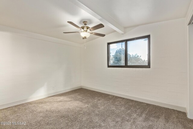 spare room featuring vaulted ceiling with beams, baseboards, a ceiling fan, and carpet