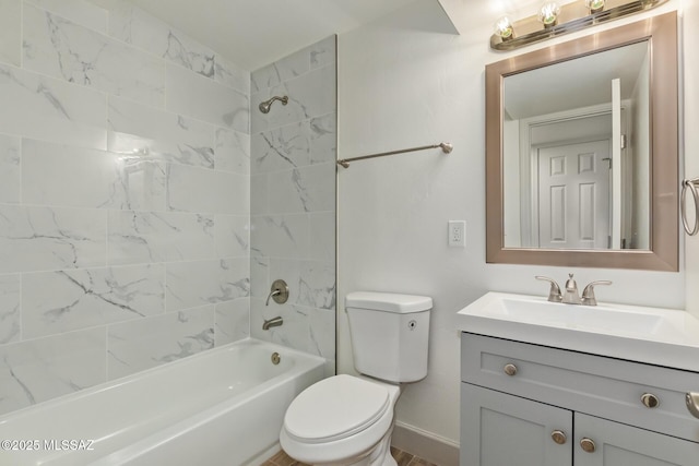bathroom featuring vanity, toilet, and shower / washtub combination