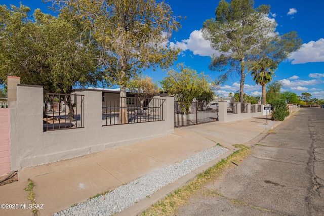 view of front of property with stucco siding and a fenced front yard