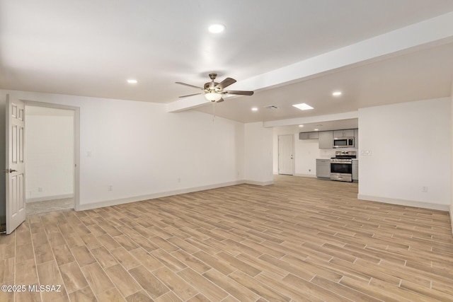 unfurnished living room with light wood finished floors, baseboards, a ceiling fan, and recessed lighting