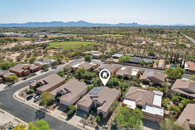 drone / aerial view with a residential view and a mountain view