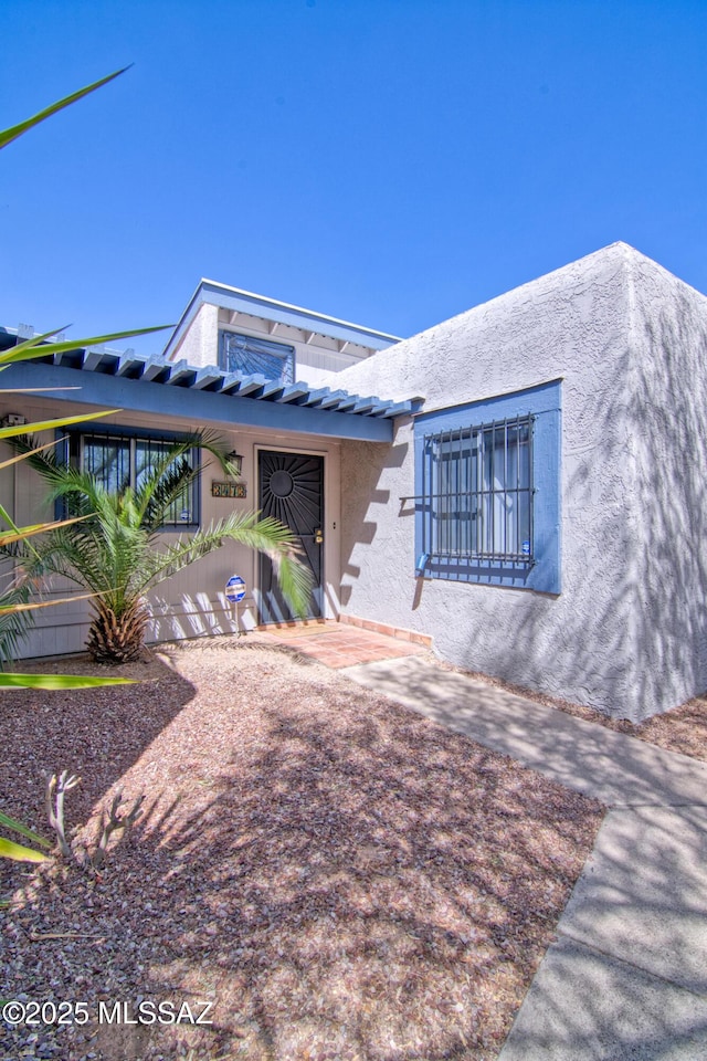 view of front of home featuring stucco siding