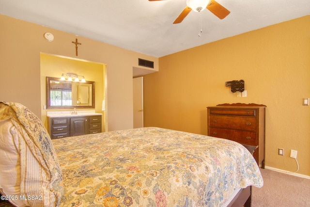 carpeted bedroom featuring baseboards, ceiling fan, and visible vents
