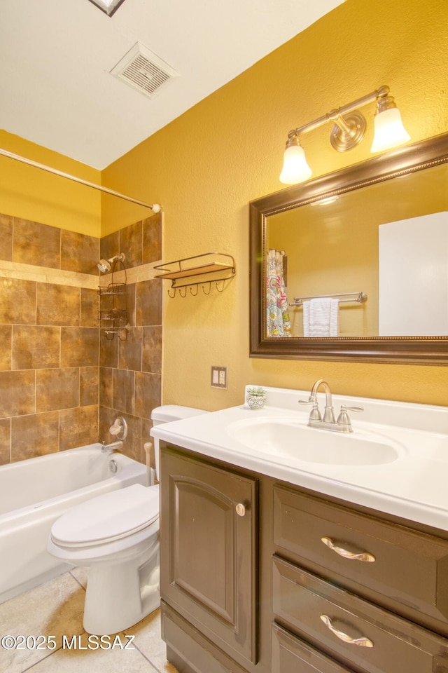 full bathroom with tile patterned floors, toilet, vanity, bathing tub / shower combination, and visible vents