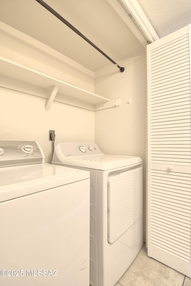 clothes washing area with laundry area and separate washer and dryer