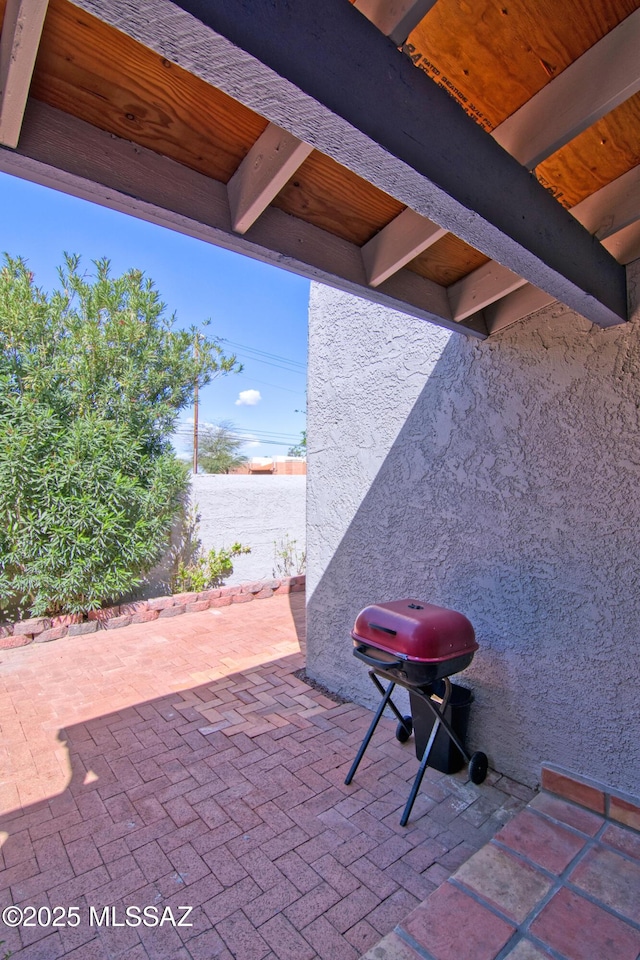 view of patio with a grill
