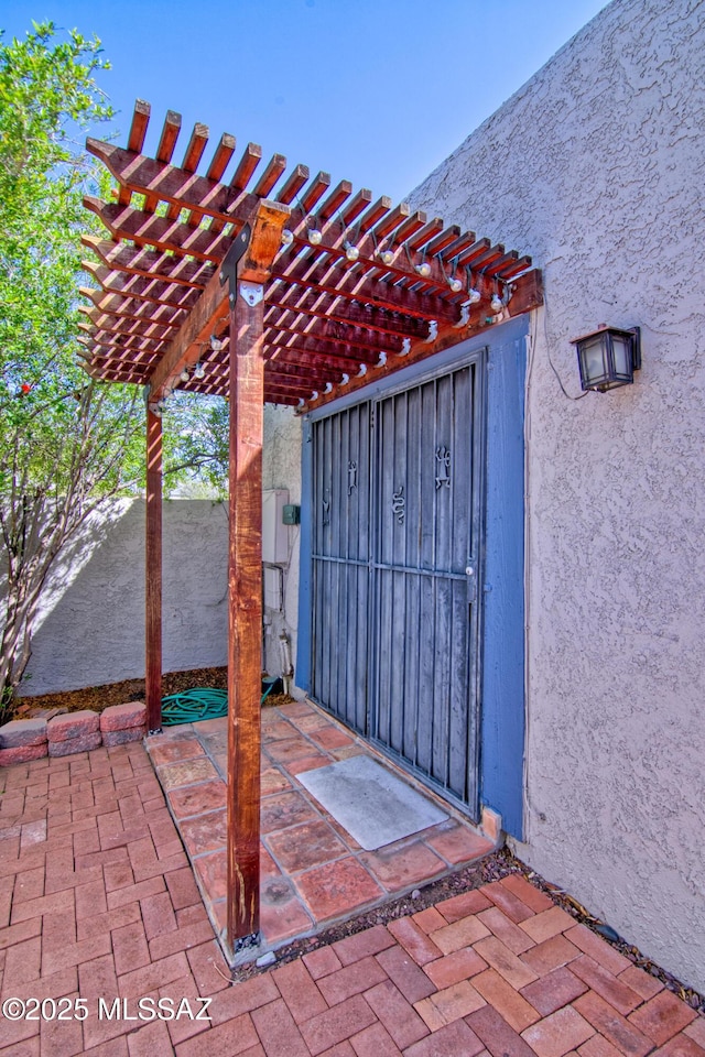 view of patio featuring a pergola