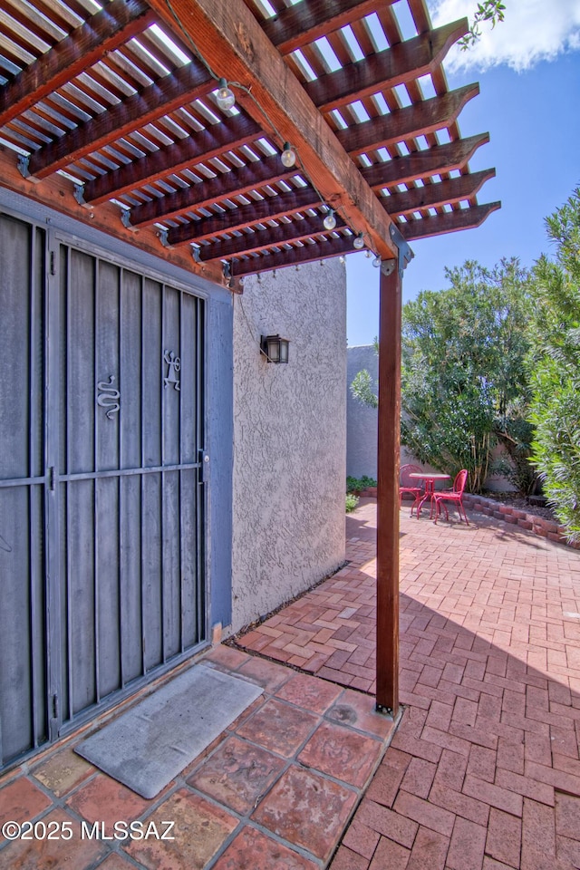 view of patio featuring a pergola
