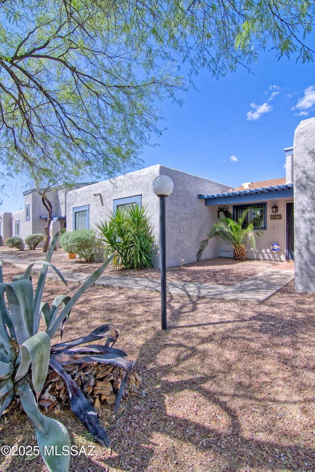 exterior space with stucco siding