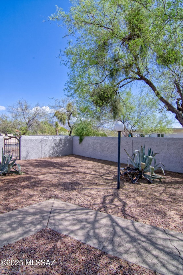 view of yard with fence