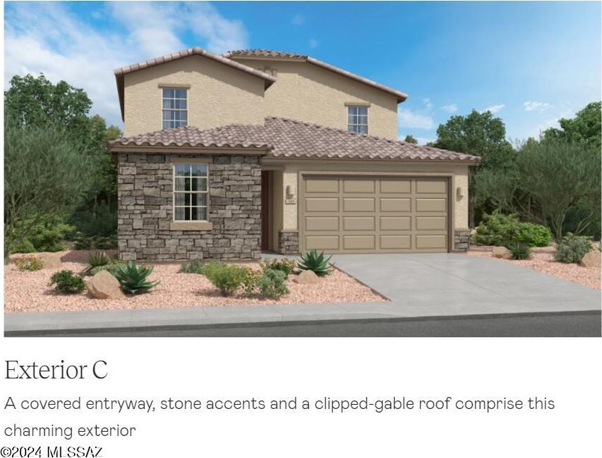 view of front of house with stone siding, a tile roof, a garage, and concrete driveway