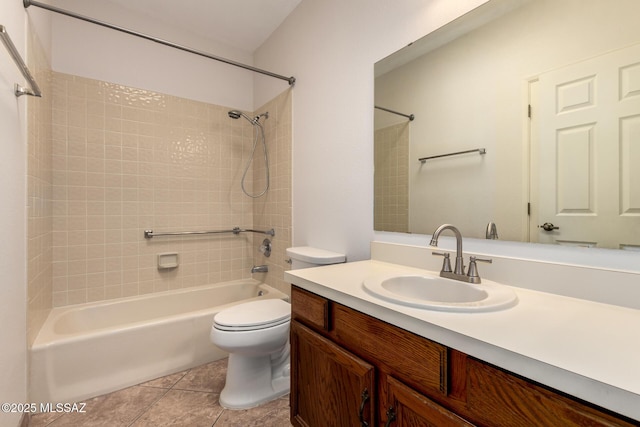 bathroom with vanity, toilet, tile patterned flooring, and shower / bath combination
