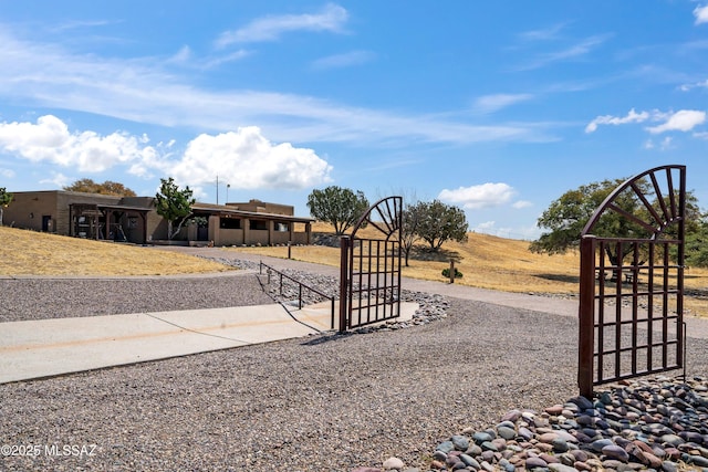 view of yard with fence and a gate