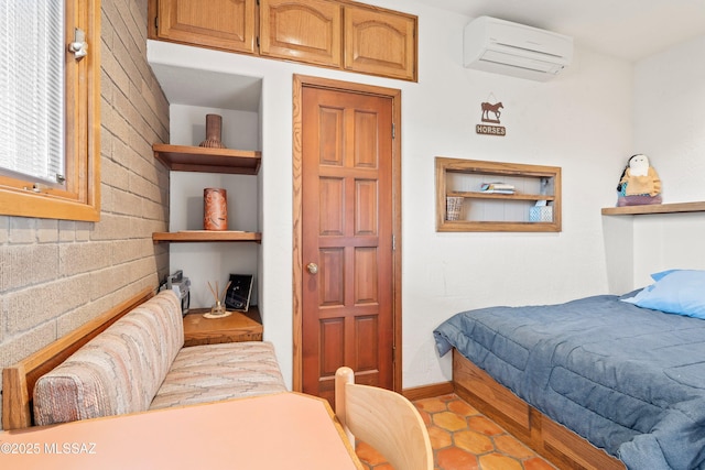 tiled bedroom featuring baseboards and a wall mounted AC