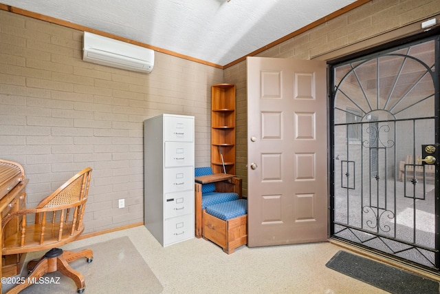 office with a wall unit AC and brick wall