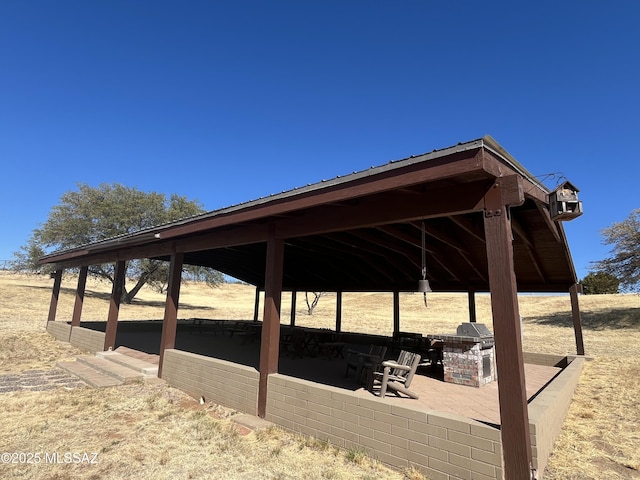 exterior space with a gazebo and a patio area