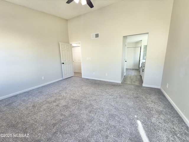 3438 Avenida Del Pueblo, Tucson, AZ 85746 - unfurnished bedroom featuring baseboards, visible vents, carpet, a ceiling fan, and high vaulted ceiling