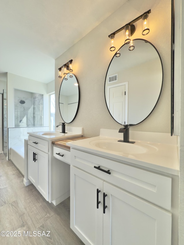 3438 Avenida Del Pueblo, Tucson, AZ 85746 - bathroom with two vanities, visible vents, and a sink