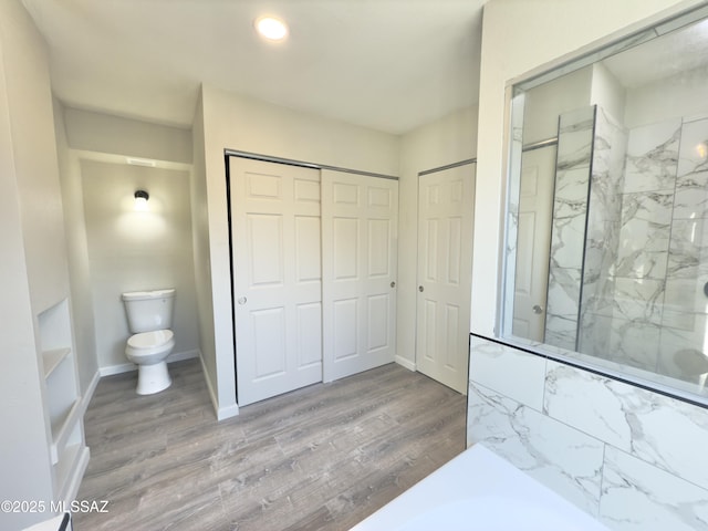 3438 Avenida Del Pueblo, Tucson, AZ 85746 - full bathroom with baseboards, wood finished floors, a marble finish shower, and toilet