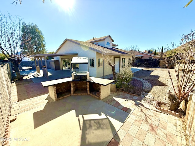 3438 Avenida Del Pueblo, Tucson, AZ 85746 - view of patio / terrace featuring an outdoor kitchen, a fenced backyard, and outdoor dry bar