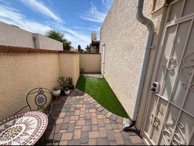 view of yard featuring a patio and fence