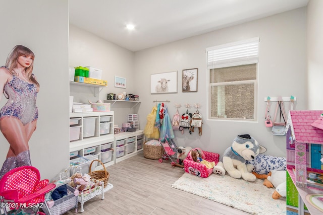 recreation room with wood finished floors