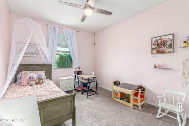 carpeted bedroom featuring baseboards and ceiling fan