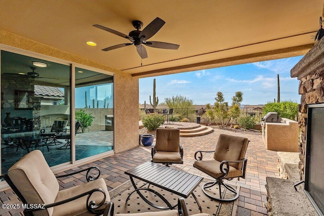 view of patio / terrace with outdoor dining space, ceiling fan, area for grilling, and fence
